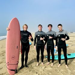 Corky Carroll's Surf School - Coach Dustin and 3 sons after all of them succeeded in catching some waves
