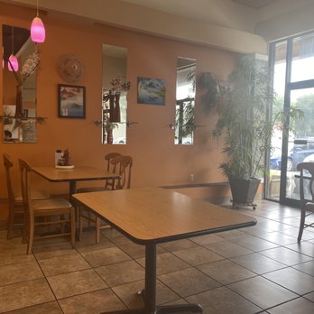 Pho Hanoi - a table and chairs in a restaurant - Vietnamese Near Me - Gainesville, Florida Pho Hanoi - a table and chairs in a restaurant - Vietnamese Near Me - Gainesville, Florida