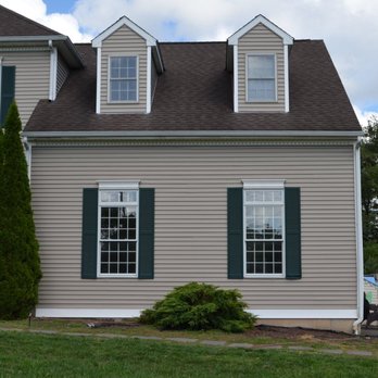 Dundon Construction - a house with a car parked in front of it - General Contractors Near Me Dundon Construction - a house with a car parked in front of it - General Contractors Near Me