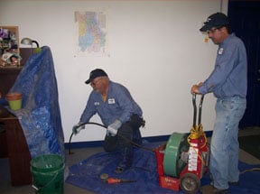 Slide of Suburban Sewer & Septic