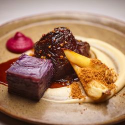 DelecTable - Wagyu short rib with parsnips, Magic Molly pommes Anna, and house-made sauerkraut purée.