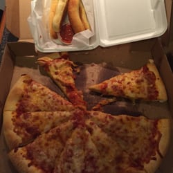 Dommy's Pizza - Soggy, bland pizza and breadsticks, that arrived cold after nearly an hour, even though I live just minutes away.