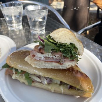 Freddo Atx - "The Freddo" panini - pepperoni, honey ham, prosciutto, mozzarella cheese, arugula, red onion, Italian dressing - Coffee & Tea Near Me - Austin, Texas