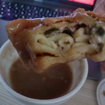 Mr A Ok's Kitchen - The inside of the Soul Roll, dipped in their sauce (gravy!) You need this in your life NOW! - Soul Food Near Me - San Antonio, Texas