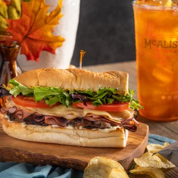 McAlister's Deli - a sub sandwich on a cutting board - Salad Near Me - Bristol, Virginia McAlister's Deli - a sub sandwich on a cutting board - Salad Near Me - Bristol, Virginia