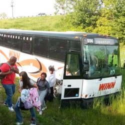 Winn Transportation - Shot of the bus as passengers are getting off after the crash. You can see Winn's logo and bus number.