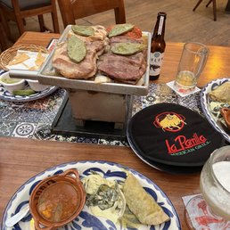 Grilled chicken, steak, pork, chorizo and cactus with warm tortillas Grilled chicken, steak, pork, chorizo and cactus with warm tortillas