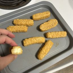 Uncooked mozzarella sticks. Uncooked mozzarella sticks.
