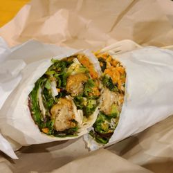 Green New American Vegetarian - Peanut chicken burrito. Mock chicken, fresh greens cabbage, carrots, green onions and crushed peanuts, sweet house peanut vinaigrette