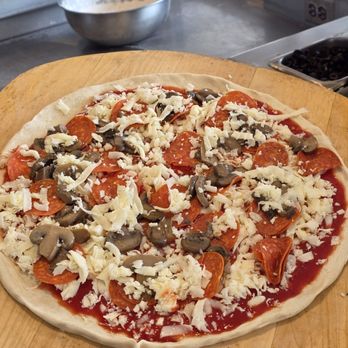 Tony Avellino's - My Peperoni and Mushroom Pizza right after it was made and just before going into the oven. - Italian Near Me - Roanoke, Virginia Tony Avellino's - My Peperoni and Mushroom Pizza right after it was made and just before going into the oven. - Italian Near Me - Roanoke, Virginia