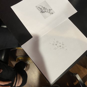 Chroma Tattoo - What I was expected to pay $150 for (right) vs what I originally wanted that "won't look good on me" (left) - Tattoo Near Me - Brighton, Michigan