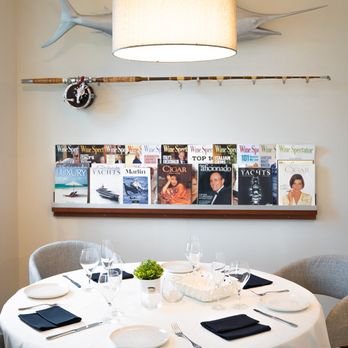 Giordi - a dining room with a table and chairs - Modern European Near Me - Stuart, Florida Giordi - a dining room with a table and chairs - Modern European Near Me - Stuart, Florida