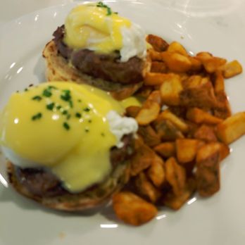 Crabtree Kitchen + Bar - Tenderloin Benedict with roasted potatoes. - Steakhouses Near Me - Poulsbo, Washington Crabtree Kitchen + Bar - Tenderloin Benedict with roasted potatoes. - Steakhouses Near Me - Poulsbo, Washington