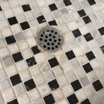 United Group Construction - This is the floor of our brand new shower. The drain looks like it's 20 years old. So sad - General Contractors Near Me United Group Construction - This is the floor of our brand new shower. The drain looks like it's 20 years old. So sad - General Contractors Near Me