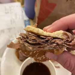 Arby's - 1/2 pound roast beef sandwich with hardly any meat. This was cut in half with a bite taken out. Less meat than the first sandwich.