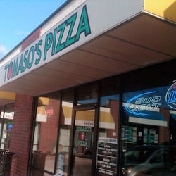 Tomaso's Pizza World Headquarters - Storefront is located in a strip mall near the city square.