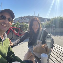 Outdoor table on the water. Perfect atmosphere, perfect latte, perfect quick breakfast Outdoor table on the water. Perfect atmosphere, perfect latte, perfect quick breakfast