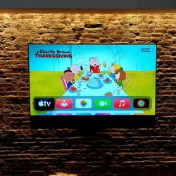 KJD AV Design - 85" Sony TV on an articulating wall mount with a Sonos arc soundbar hidden behind a custom made sound bar case and cover to match TV width.