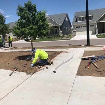 Incas Lawn Services - a man working on a sidewalk - Lawn Services Near Me Incas Lawn Services - a man working on a sidewalk - Lawn Services Near Me