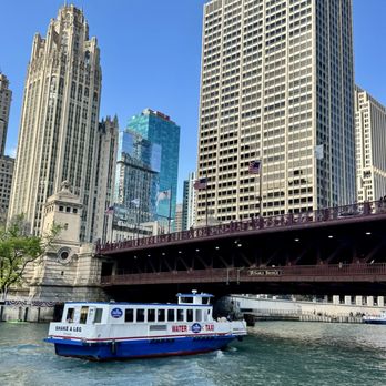 Michigan Avenue Bridge - 07.04.25 water taxi passing underneath the Michigan Avenue Bridge - Landmarks & Historical Buildings Near Me - Chicago, Illinois Michigan Avenue Bridge - 07.04.25 water taxi passing underneath the Michigan Avenue Bridge - Landmarks & Historical Buildings Near Me - Chicago, Illinois