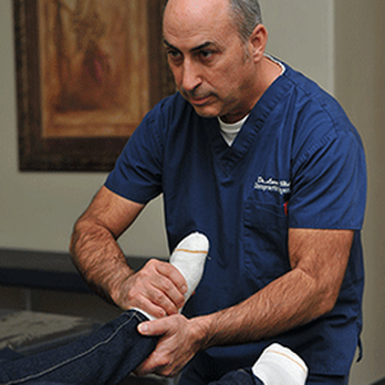 Sundance Chiropractic - Dr Larry Holt adjusting a patients foot. - Chiropractors Near Me - North Las Vegas, Nevada Sundance Chiropractic - Dr Larry Holt adjusting a patients foot. - Chiropractors Near Me - North Las Vegas, Nevada