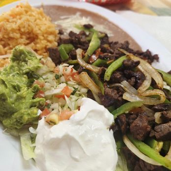 El Grande Burrito - Beef Fajitas for one. Included rice, beans, guacamole, sour cream, pico and tortillas. - Mexican Near Me - Allen, Texas El Grande Burrito - Beef Fajitas for one. Included rice, beans, guacamole, sour cream, pico and tortillas. - Mexican Near Me - Allen, Texas