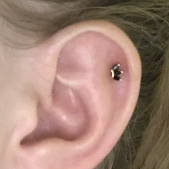 Identity Body Piercing - Helix ear piercing with onyx and gold fan shaped stud done by Joanna - Piercing Near Me - Chicago, Illinois