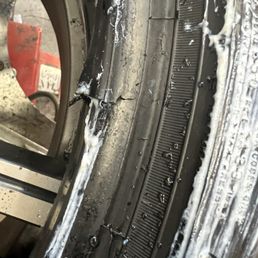Tire with tear in bead.