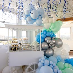 a display of balloons and confetti