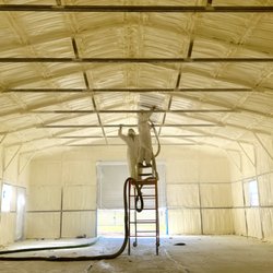 Foam Tex Insulation - Closed-cell insulation being installed in a 30' x 50' metal building.