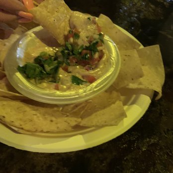 Sanchos - Chips and queso. Very little on the paper plate. - Cocktail Bars Near Me - San Antonio, Texas Sanchos - Chips and queso. Very little on the paper plate. - Cocktail Bars Near Me - San Antonio, Texas
