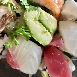 Rainbow roll: fresh sashimi atop dynamite roll