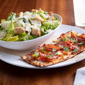 Seasons 52 - Our seasonal menu offers a variety of lunch pairings of a half flatbread with a soup or salad, as well as entrées and handhelds - New American Near Me - Jacksonville, Florida Seasons 52 - Our seasonal menu offers a variety of lunch pairings of a half flatbread with a soup or salad, as well as entrées and handhelds - New American Near Me - Jacksonville, Florida