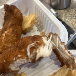 When I cut into the chicken tender oil squirted out and it's just a stringy disgusting grossness When I cut into the chicken tender oil squirted out and it's just a stringy disgusting grossness