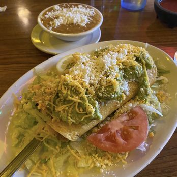 Mi Nidito Restaurant - Two flautas with side of beans. - Mexican Near Me - Tucson, Arizona Mi Nidito Restaurant - Two flautas with side of beans. - Mexican Near Me - Tucson, Arizona