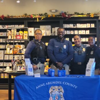 Baltimore Coffee & Tea - Background shows all the teas for sale on Coffee with a Cop day in October 2022 - Coffee & Tea Near Me - Odenton, Maryland