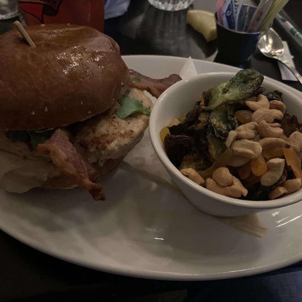 Merchants Pub & Plate - Grilled chicken sandwich with gruyere cheese and Brussels Sprouts - New American Near Me - Lawrence, Kansas Merchants Pub & Plate - Grilled chicken sandwich with gruyere cheese and Brussels Sprouts - New American Near Me - Lawrence, Kansas