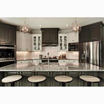 HYM Construction - a kitchen with granite countertops and a center island - General Contractors Near Me