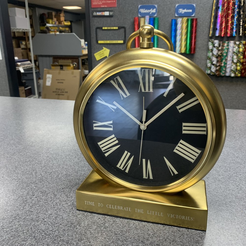 Beautiful engraving by Raymonds Trophy, they did such a great job, provided lots of font options and were able to engrave on the clock! Beautiful engraving by Raymonds Trophy, they did such a great job, provided lots of font options and were able to engrave on the clock!
