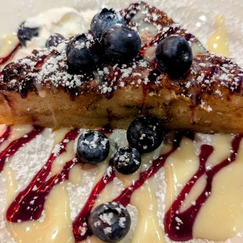 EastWest - WHITE CHOCOLATE BREAD PUDDING: vanilla anglaise, berries - New American Near Me - Birmingham, Alabama