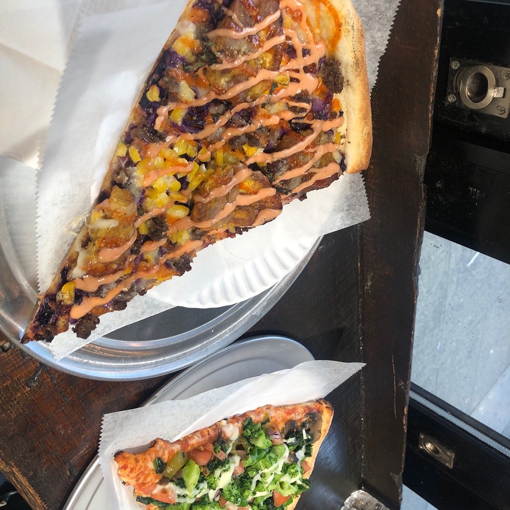 two slices of pizza on a plate two slices of pizza on a plate