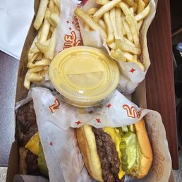 OK Onion Burger and French Fries with a side of cheese sauce.