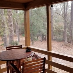 Cheraw State Park - Another view of the woods from the screened-in porch. There's a table with four high chairs/stools!