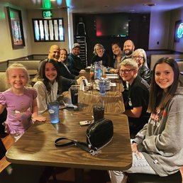 a group of people sitting at a table