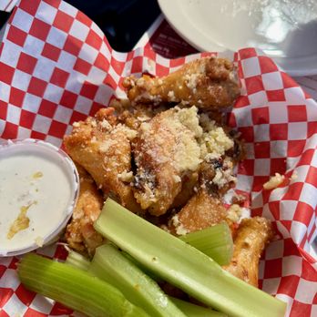 Rocco's Tavern - Crispy chicken wings with Garlic-Parmesan topping. - Italian Near Me - Studio City, California Rocco's Tavern - Crispy chicken wings with Garlic-Parmesan topping. - Italian Near Me - Studio City, California