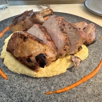 Saltbrush - Grilled Kurobuta Double Pork Chop creamy polenta, calabria chili vinaigrette - Wine Bars Near Me - Boise, Idaho Saltbrush - Grilled Kurobuta Double Pork Chop creamy polenta, calabria chili vinaigrette - Wine Bars Near Me - Boise, Idaho