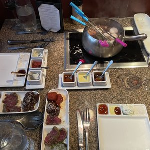 Photo of The Melting Pot - Grand Rapids, MI, United States. Entrees - steak lovers and classic in coq a vin
