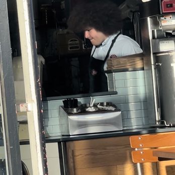 Jersey Mike's Subs - a woman in a kitchen - Sandwiches Near Me - Huntington beach, California