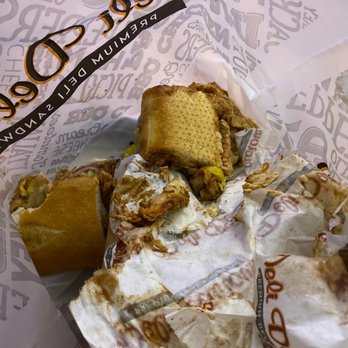 Deli Delicious - a half eaten sandwich in a wrapper - Sandwiches Near Me - Modesto, California