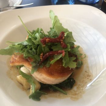 S'Angel - Grilled salmon on bed of goat cheese, salmon and gnocchi with tamarind and orange sauce. yum! - Tapas Bars Near Me - Palma, PM